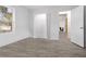 Bright bedroom with large window, neutral walls, closet and doorway to a full bath and laundry area at 2458 Calvin Ave, East Point, GA 30344