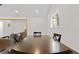 Dining room featuring a large table with natural light and an open view into the living area at 2458 Calvin Ave, East Point, GA 30344