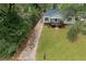 Charming single Gathering home featuring a well-maintained lawn and inviting front porch at 2458 Calvin Ave, East Point, GA 30344