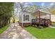 Charming home featuring a well-manicured lawn, driveway, and a porch at 2458 Calvin Ave, East Point, GA 30344