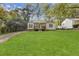 Charming home featuring a well-manicured lawn and inviting front porch at 2458 Calvin Ave, East Point, GA 30344