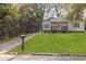 Charming home featuring a well-manicured lawn, driveway, and inviting porch at 2458 Calvin Ave, East Point, GA 30344