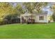 Charming home featuring a well-manicured lawn and inviting front porch at 2458 Calvin Ave, East Point, GA 30344
