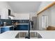 Kitchen with quartz countertops, stainless steel appliances, designer tile backsplash, and ample storage at 2458 Calvin Ave, East Point, GA 30344