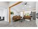 Inviting living room features a vaulted ceiling, recessed lighting, and comfortable seating with a modern fireplace at 2458 Calvin Ave, East Point, GA 30344