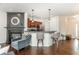 Bright living room featuring a fireplace, hardwood flooring, and comfortable seating, creating a cozy atmosphere at 295 Kigian Trl, Woodstock, GA 30188