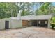 Side view of home showing a large backyard, garage, and mature landscaping at 2950 Duke Of Gloucester, Atlanta, GA 30344