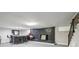 Finished basement wet bar area featuring black brick accents and seating at 2950 Duke Of Gloucester, Atlanta, GA 30344