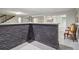 Finished basement wet bar with brick accents, stairs and seating at 2950 Duke Of Gloucester, Atlanta, GA 30344