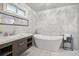 Modern bathroom with a freestanding tub, stylish vanity, and sleek fixtures at 2950 Duke Of Gloucester, Atlanta, GA 30344