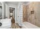 Bathroom features a tub/shower combo, modern vanity, and a hallway view at 2950 Duke Of Gloucester, Atlanta, GA 30344