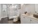 A modern bathroom features tiled walls, a glass shower door, and an updated vanity at 2950 Duke Of Gloucester, Atlanta, GA 30344