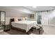 Cozy bedroom with barn door to bathroom, furnished with queen bed and stylish decor at 2950 Duke Of Gloucester, Atlanta, GA 30344