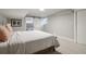 Bedroom featuring a barn door to the bathroom and a clean, modern aesthetic at 2950 Duke Of Gloucester, Atlanta, GA 30344