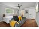 Bedroom featuring hardwood floors, a bed, and a seating area at 2950 Duke Of Gloucester, Atlanta, GA 30344