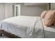 Bedroom featuring a queen bed with comfortable white linens and stylish pink throw pillows at 2950 Duke Of Gloucester, Atlanta, GA 30344