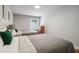 Bright bedroom featuring two beds, hardwood floors, and natural light from a window at 2950 Duke Of Gloucester, Atlanta, GA 30344