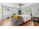 Bedroom features a bed, sitting area, hardwood floors and natural light at 2950 Duke Of Gloucester, Atlanta, GA 30344