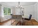 Bright dining room with a modern chandelier, hardwood floors, and large window at 2950 Duke Of Gloucester, Atlanta, GA 30344