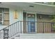 Close-up of a charming front porch with a decorative door, stylish railing, and classic brick accents at 2950 Duke Of Gloucester, Atlanta, GA 30344