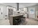 Kitchen features a large island, stainless steel appliances, white cabinets, and tile backsplash at 2950 Duke Of Gloucester, Atlanta, GA 30344
