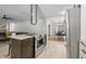 Kitchen features stainless steel appliances, a large island, tile flooring, and view of the dining area at 2950 Duke Of Gloucester, Atlanta, GA 30344