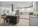 Kitchen featuring white cabinets, a large island, stainless steel appliances, and tile flooring at 2950 Duke Of Gloucester, Atlanta, GA 30344