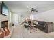 Living room featuring a brick fireplace, carpet flooring, a ceiling fan and stairs to the second level at 2950 Duke Of Gloucester, Atlanta, GA 30344