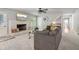 Living room features a fireplace, carpet flooring, a ceiling fan, and stairs to the second level at 2950 Duke Of Gloucester, Atlanta, GA 30344