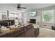 Bright living room with a brick fireplace, open concept to the kitchen, and hardwood floors at 2950 Duke Of Gloucester, Atlanta, GA 30344