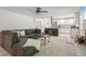 Living room featuring a fireplace, carpet flooring, stairs, and an open concept to the kitchen at 2950 Duke Of Gloucester, Atlanta, GA 30344