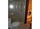 Bathroom featuring a glass-enclosed shower and washer, and dryer at 9031 Thornton Rd, Jonesboro, GA 30236