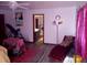 Cozy bedroom with vibrant decor, a lounge chair, and ensuite bathroom at 9031 Thornton Rd, Jonesboro, GA 30236