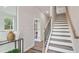 Welcoming entryway with a staircase, modern decor, and ample natural light creates a warm, inviting ambiance at 126 Asland Ln # 28, Hapeville, GA 30354