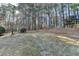 Sprawling backyard with mature trees, offering a private and tranquil outdoor space at 420 Woodbrook Way, Lawrenceville, GA 30043