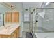 Bathroom with a shower, large vanity, and patterned wallpaper for a clean and functional design at 420 Woodbrook Way, Lawrenceville, GA 30043