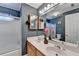 Charming bathroom featuring dual sinks, large mirror and a shower with frosted glass at 420 Woodbrook Way, Lawrenceville, GA 30043