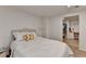 Bright bedroom with a large bed, white walls and access to the closet/vanity room at 420 Woodbrook Way, Lawrenceville, GA 30043