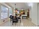 Bright eat-in kitchen features large windows and a black accent tile floor at 420 Woodbrook Way, Lawrenceville, GA 30043