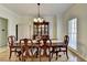 Formal dining room with hardwood floors and a classic china cabinet at 420 Woodbrook Way, Lawrenceville, GA 30043