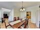 Elegant dining room with hardwood floors and a classic chandelier at 420 Woodbrook Way, Lawrenceville, GA 30043