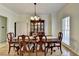 Elegant dining room with hardwood floors, stylish chandelier, and classic furniture at 420 Woodbrook Way, Lawrenceville, GA 30043