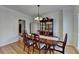 Elegant dining room with hardwood floors, stylish chandelier, and classic furniture at 420 Woodbrook Way, Lawrenceville, GA 30043