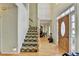 Inviting foyer with hardwood floors, staircase, and natural light through the front door at 420 Woodbrook Way, Lawrenceville, GA 30043