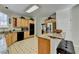 Kitchen featuring wood cabinets, stainless steel appliances, and a center island at 420 Woodbrook Way, Lawrenceville, GA 30043