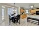Kitchen with stainless steel appliances, a dining table, and hardwood floors at 420 Woodbrook Way, Lawrenceville, GA 30043