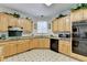 Bright kitchen showcasing wooden cabinetry, granite counters, and modern appliances at 420 Woodbrook Way, Lawrenceville, GA 30043