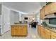 Open kitchen featuring an island with granite countertops and a dining area at 420 Woodbrook Way, Lawrenceville, GA 30043