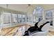 Open sunroom with many windows offering plenty of natural light at 420 Woodbrook Way, Lawrenceville, GA 30043