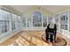 Sunroom with many windows and wood floors at 420 Woodbrook Way, Lawrenceville, GA 30043